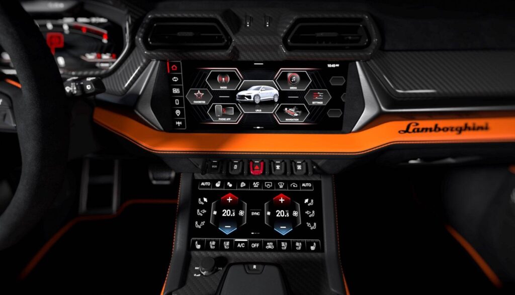 Console centrale du Lamborghini Urus SE : écran multimédia, commandes de climatisation et inserts orange